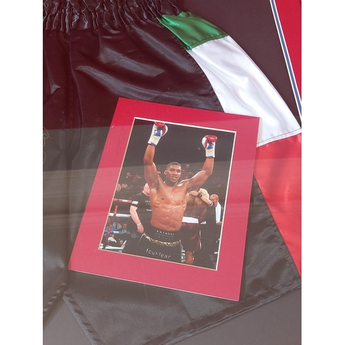 230 - Anthony Joshua signed framed boxing trunks length 83cm height 84 cm. With authenticity certificate