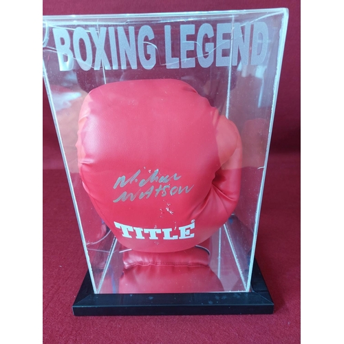 232 - Michael Watson signed boxing glove. Damage to plastic cover. With authenticity certificate