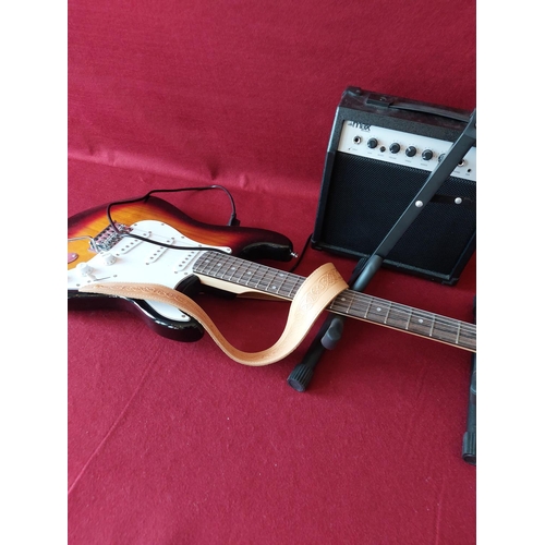 300 - Electric guitar with stand and amp.