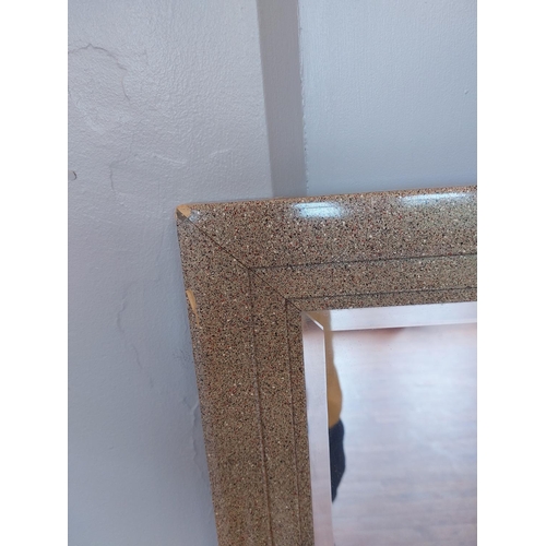 312 - Large bevelled mirror with stone effect frame slight damage as pictured. H51