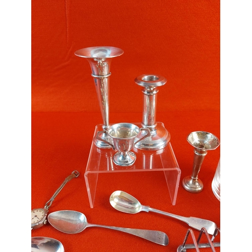 100 - Collection of mixed hallmarked silver. Candle sticks and flutes are filled. Total weight without gla... 