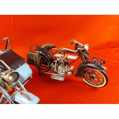 244 - 2 Tin and metal  motorcycle ornaments unnamed. Each measuring approximately 12inches long.