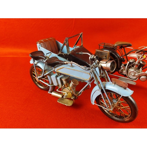 244 - 2 Tin and metal  motorcycle ornaments unnamed. Each measuring approximately 12inches long.