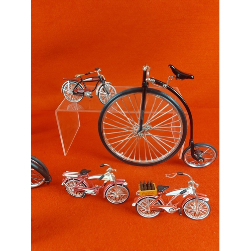 249 - Collection of 4 metal pedal bikes & 4 plastic miniature American style bikes approx 3.5