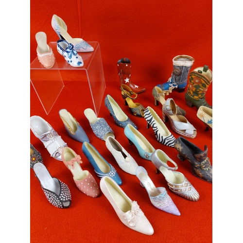 299 - Collection of 27 miniature shoes in different styles.