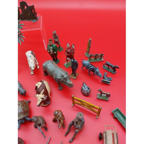 312 - Collection of lead and tin figures and animals.