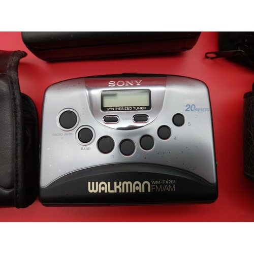 319 - Original Sony Walkman with original case and JVC walkman.