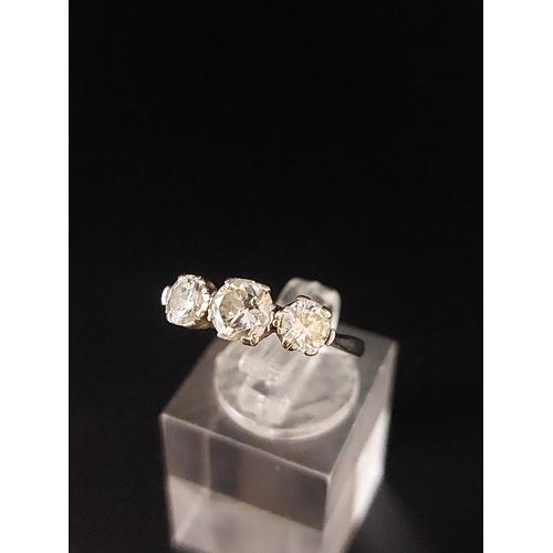 70 - Platinum (950) trilogy ring. One 0.50 carat diamond, two 0.25 carat diamonds. Total weight 2.2 grams... 