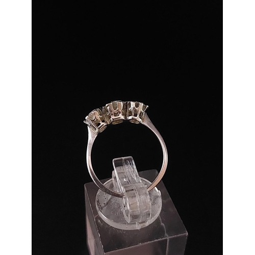 70 - Platinum (950) trilogy ring. One 0.50 carat diamond, two 0.25 carat diamonds. Total weight 2.2 grams... 