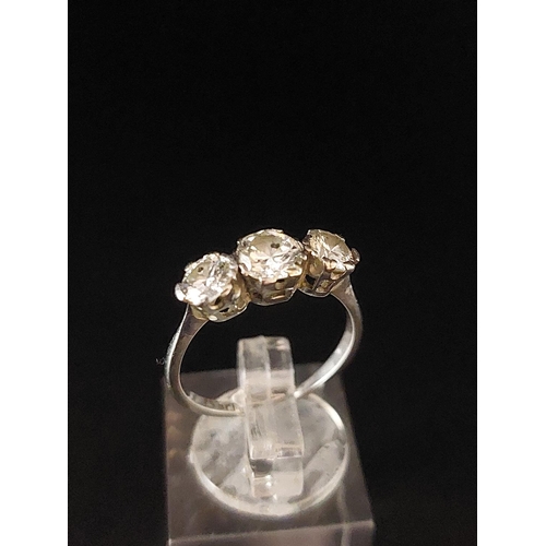 70 - Platinum (950) trilogy ring. One 0.50 carat diamond, two 0.25 carat diamonds. Total weight 2.2 grams... 