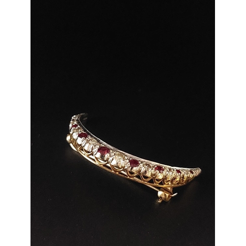 72 - Vintage ruby and diamond crescent brooch set in 9ct gold. 9 rubies, 8 diamonds. Total weight 6.7 gra... 