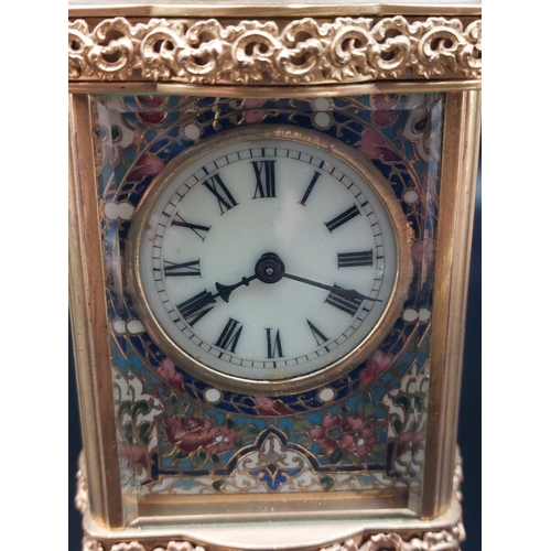 96 - Ornate antique brass carriage clock with enameled front plate. Beveled glass and top platform escape... 