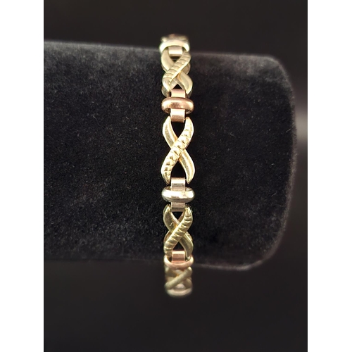 11 - 9ct gold kiss link bracelet 9.9 grams