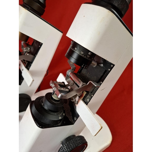 146 - 2 scientific microscopes. Maybe optical. One has wire.