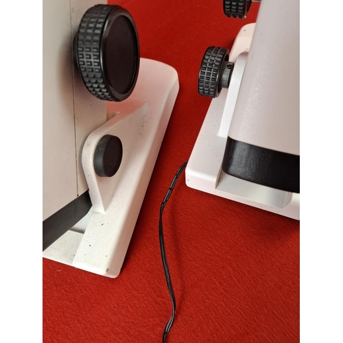 146 - 2 scientific microscopes. Maybe optical. One has wire.