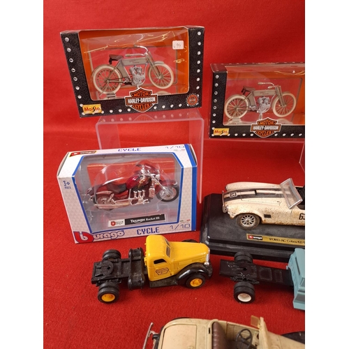 311 - Collection of die cast model cars and motorbikes. Makers include Budgie, ERTL, Burago