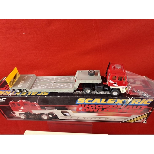 319 - 2 x vintage Scalextric Juggernauts one Road train and one Lowrider. Boxed in excellent condition