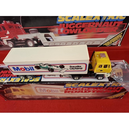 319 - 2 x vintage Scalextric Juggernauts one Road train and one Lowrider. Boxed in excellent condition