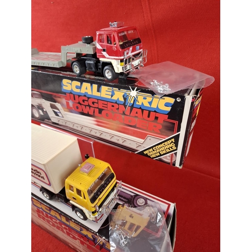 319 - 2 x vintage Scalextric Juggernauts one Road train and one Lowrider. Boxed in excellent condition