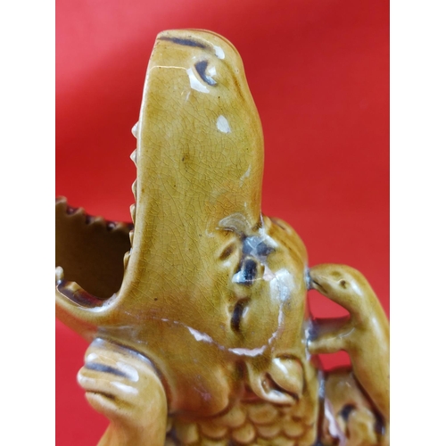 361 - Burmantofts green pottery Basilisk dragon jug. Has had a repair as pictured but could be restored no... 