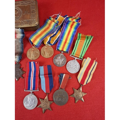 128 - Collection of WW1 and WW2 medals  including 1914 Christmas tin and others. WW1 medals 3 x medals to ... 