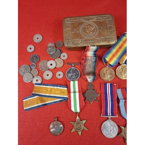 128 - Collection of WW1 and WW2 medals  including 1914 Christmas tin and others. WW1 medals 3 x medals to ... 