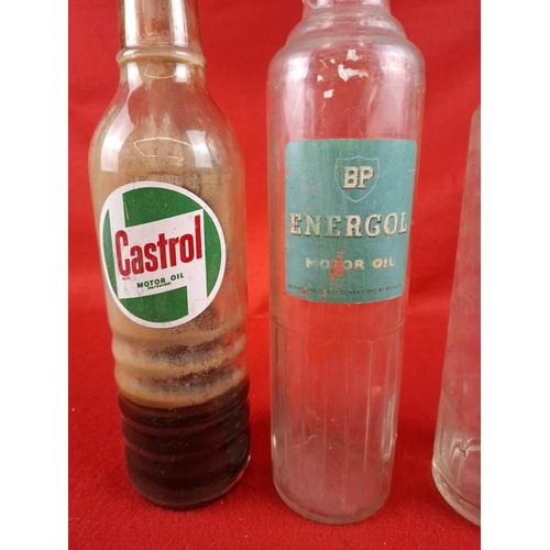 208 - 3 vintage oil bottles including Castrol,BP and Esso.