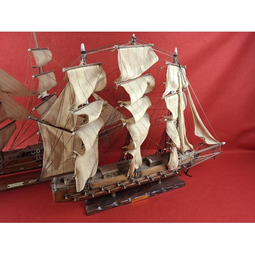 271 - 2 wooden model frigates. Taller model to left Height 24