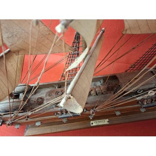 271 - 2 wooden model frigates. Taller model to left Height 24