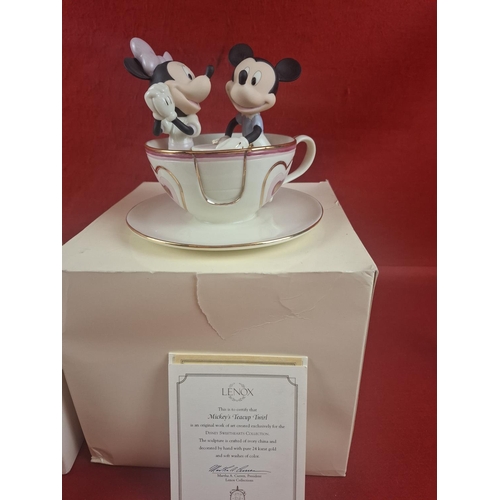 283 - 2 Lenox Disney fine china figurines featuring Pooh's Christmas Sleigh Ride and Mickey's Tea Cup Twir... 