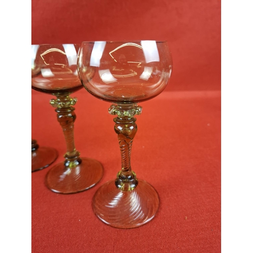 294 - Collection of 6 antique German Green wine glasses with twisted stems and wrythen feet.