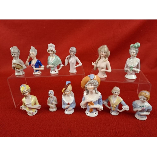 306 - Nice collection of china pin chusion dolls including Bisque German doll marked 3615