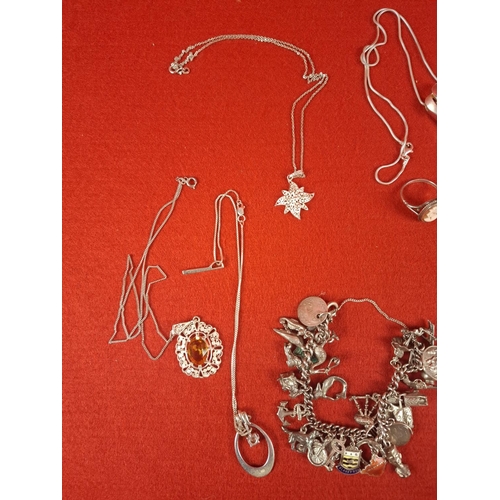 57 - Collection of silver hallmarked jewellery including charm bracelet, necklaces and pins total weight ... 