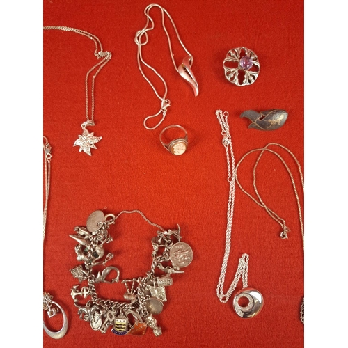 57 - Collection of silver hallmarked jewellery including charm bracelet, necklaces and pins total weight ... 