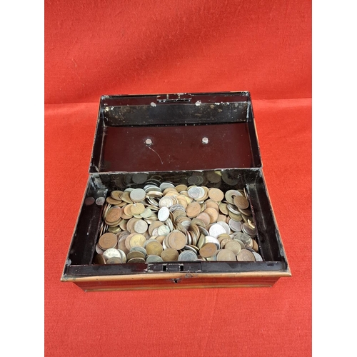 202 - Tin box of assorted coins.