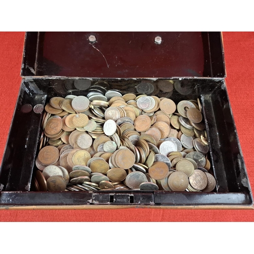 202 - Tin box of assorted coins.