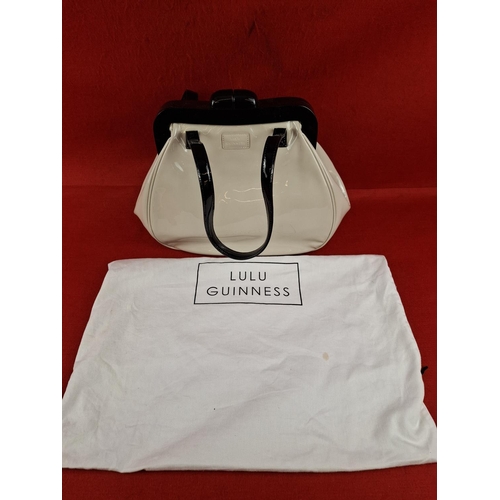 208 - Lulu Guinness designer cream and black patent handbag unused with storage bag.