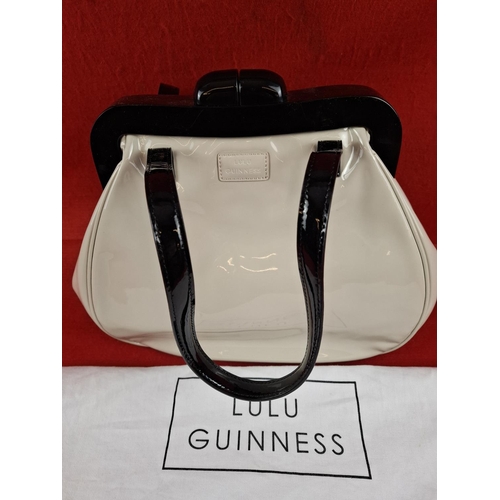 208 - Lulu Guinness designer cream and black patent handbag unused with storage bag.