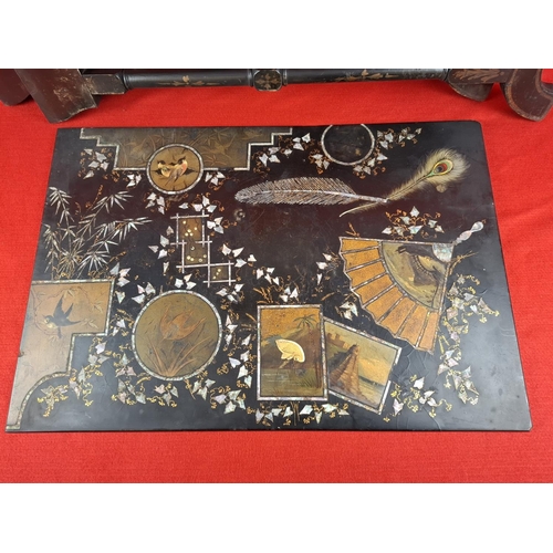 218 - Oriental black lacquer mother of pearl inlay coffee table. Legs require re attaching.