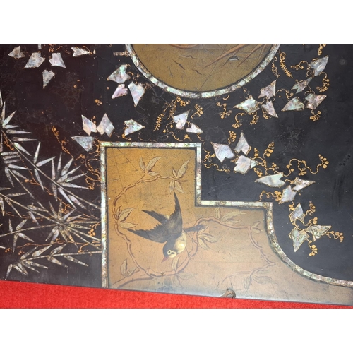 218 - Oriental black lacquer mother of pearl inlay coffee table. Legs require re attaching.