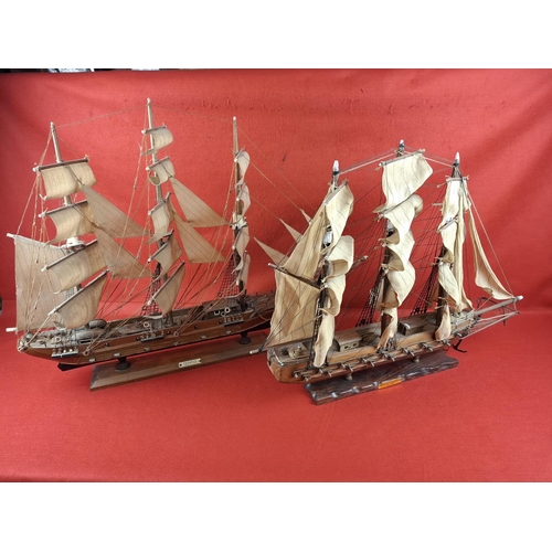 231 - 2 wooden model frigates. Taller model to left Height 24