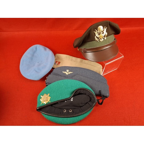 258 - Collection of various military berets and hats.