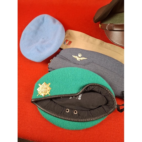 258 - Collection of various military berets and hats.