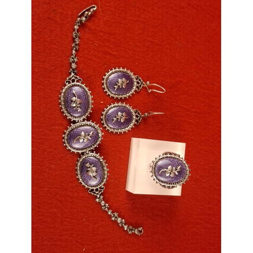 100 - Attractive early 20th century silver hallmarked set including bracelet, earrings and ring with ename... 