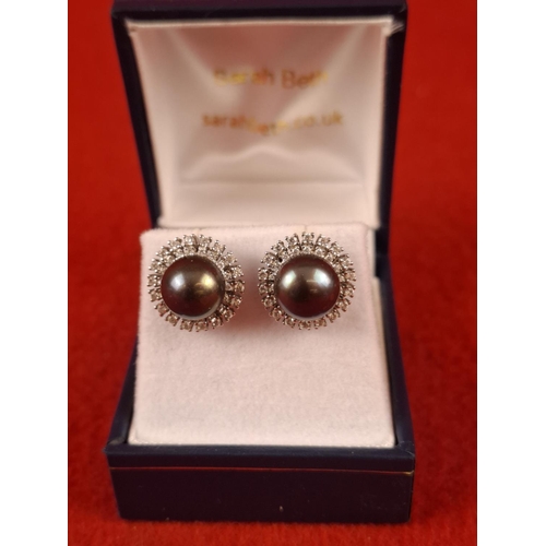 102 - Hallmarked Silver mounted pearl and diamond earrings