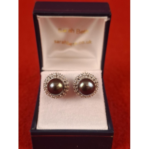 102 - Hallmarked Silver mounted pearl and diamond earrings