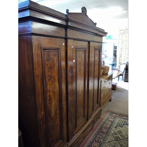 1190 - Victorian Figured Mahogany Breakfront Triple Wardrobe with Architectural Pediment.