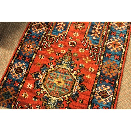 1188 - Length of Vintage Wool Carpet Runner decorated with Geometric shapes on a red ground.