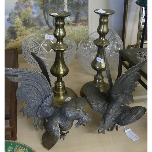 571 - Pair of Brass Candlesticks & White Metal Fighting Cockerels.