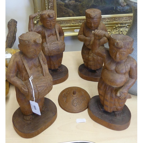 606 - Four Eastern Carved Wood Figures.